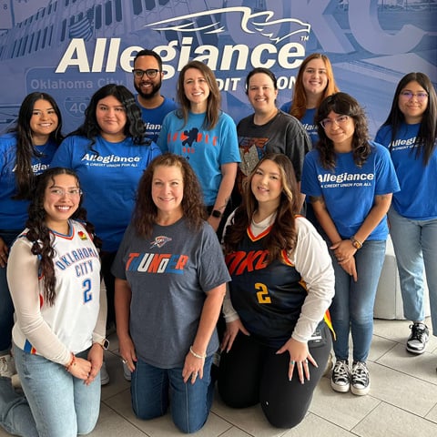 Allegiance employees dressed in OKC Thunder gear