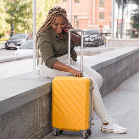 Fast-cash-loans-helped-this-woman-sitting-outstide-of-a-bus-station-pay-for-a-new-ticket.