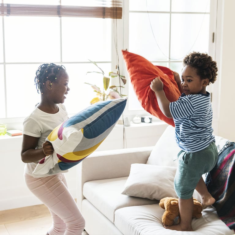 HVAC-financing-helped-these-young-children-stay-cool-while-having-a-pillow-fight-inside-during-the-summer-months.