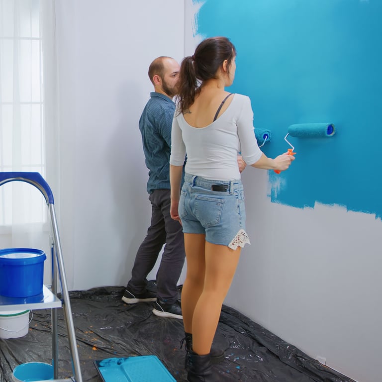 A-personal-line-of-credit-is-helping-this-couple-paint-their-living-room-blue.