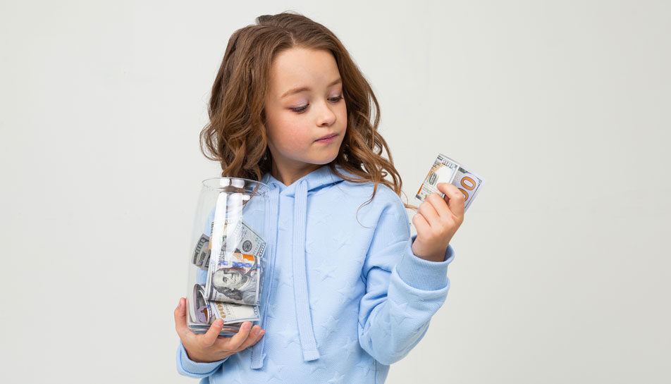 Young-girl-looking-at-money-in-her-hand.